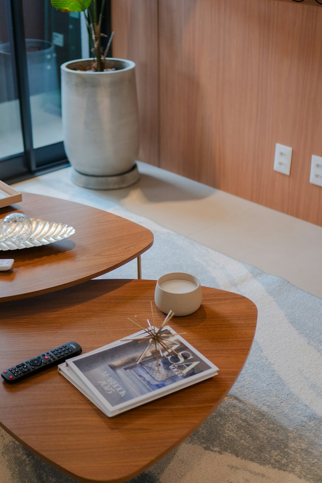 Broadcast control room with operators monitoring live news feeds on multiple screens