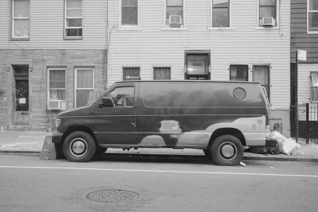 Outside broadcast van with satellite dish parked outside a news event